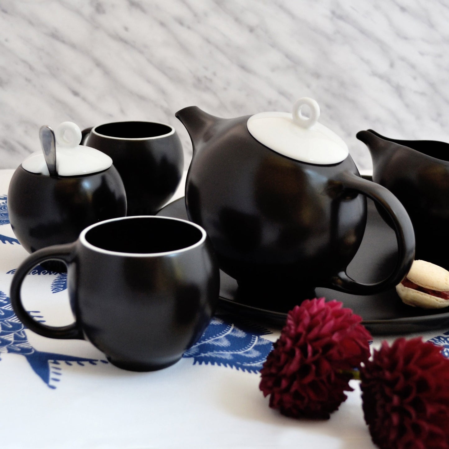 Black ceramic designer teapot with stainless steel filter