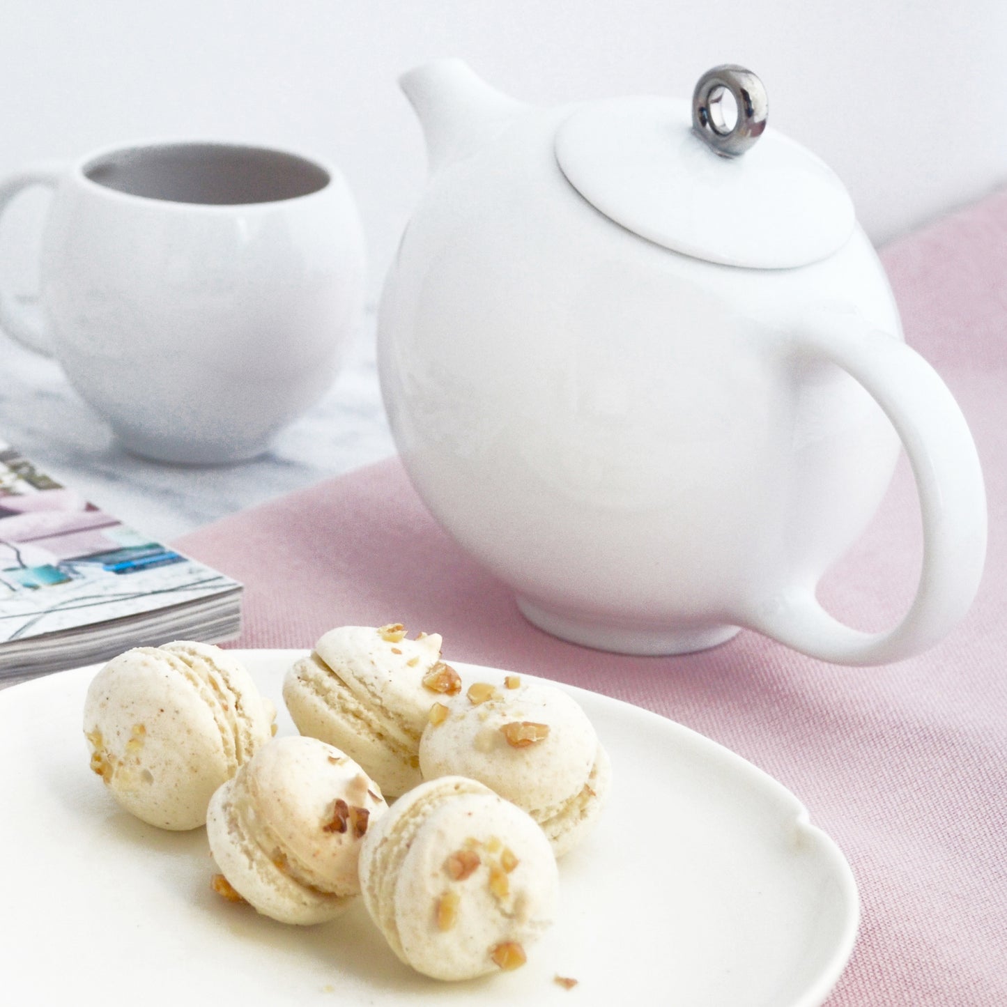 White porcelain Eva Zeisel teapot with mesh filter