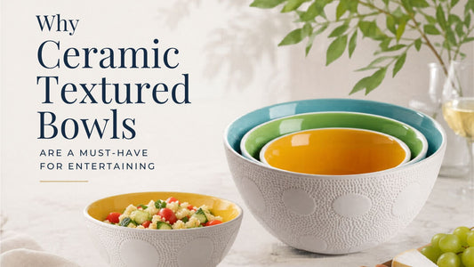 Modern ceramic textured serving bowls with colorful interiors styled on a marble table for entertaining and dining decor blog header image