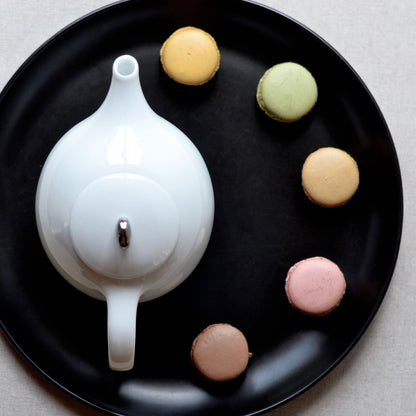 White porcelain Eva Zeisel teapot with mesh filter