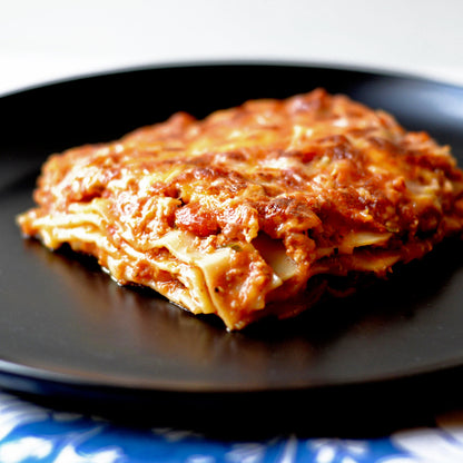 Matte black ceramic dinner plate with wide stoneware surface