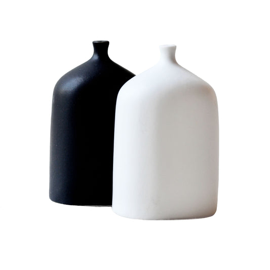 Modern minimalist salt and pepper shakers in high-fired porcelain by Maia Ming Designs, featuring a whimsical sculptural form. Zen inspired home decor for mindful daily rituals, food-safe artisan pottery handmade in Barcelona, perfect for interior styling or boutique hotel decor.