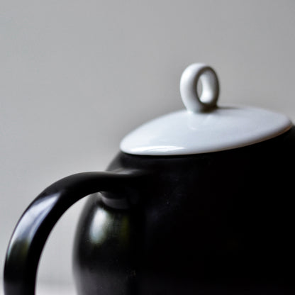 Black ceramic designer teapot with stainless steel filter