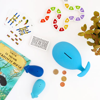 Blue whale piggy bank with ceramic body and coin slot